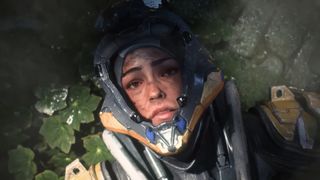 Screenshot of Anthem machine pilot lying on the leafy ground with visor open